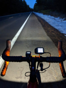 Anne’s husband Tim riding his e-assist (Trek Domane +) bike up Skyliners Road in Bend at dusk.