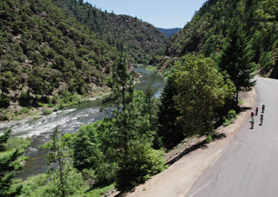 BRNW Small Group Tours 2024 riding by Rogue river